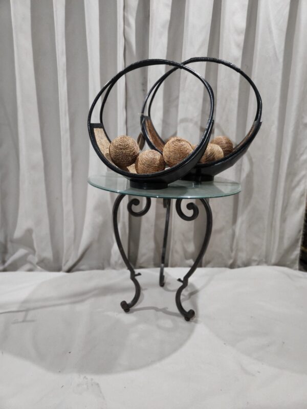 Two baskets with rattan balls and glass top table