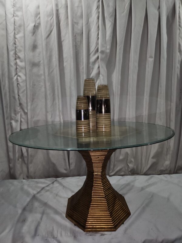 Gold tone metal and glass table