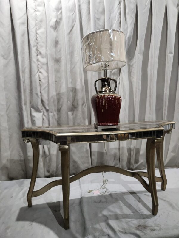 Entry way glass and pewter tone table with lamp